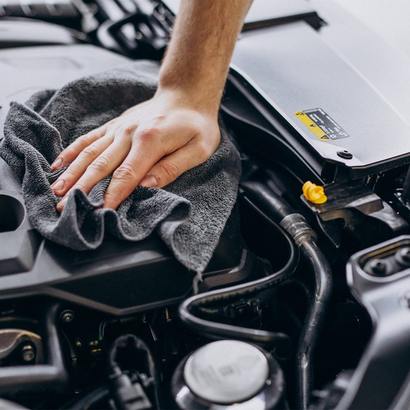 Man polishing car inside at car service Man polishing car inside at car service